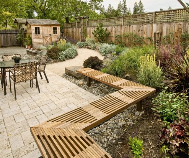 Backyard Landscape with Rock beds under seating